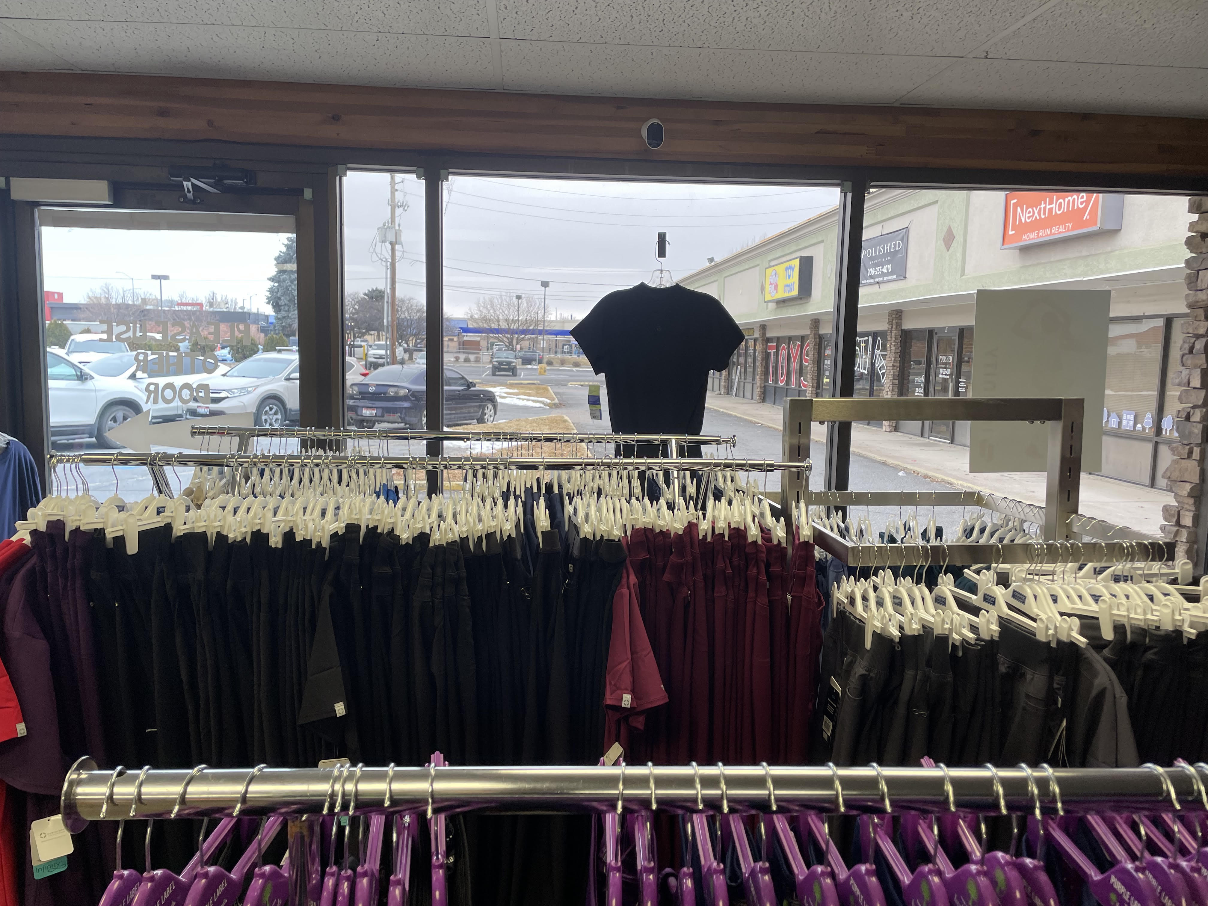 View across the scrub racks toward the Scrub JCT storefront window